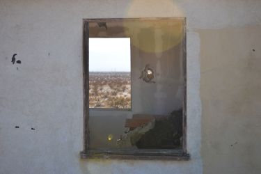 Window view, abandoned settler shack, Wonder Valley, California.