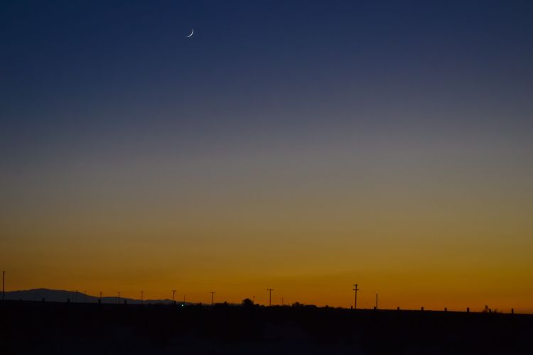 Crescent moon, sunset, Wonder Valley, California.