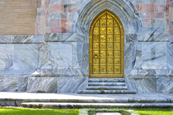 The Great Brass Door of Bok Tower, set amid a beautiful marble backdrop.