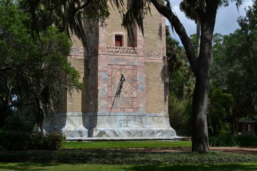 Sundial, light, and shadow on the south side of Bok Tower, Florida.
