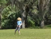 Lisa, turning cartwheels at Bok Tower, Florida.