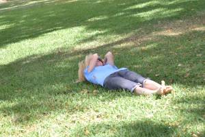 Lisa, laughing like a five-year old, rolls downhill on the soft grass of the Bok Tower sanctuary.