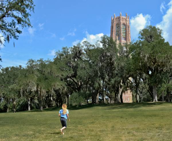 Lisa, running across the lawn, Bok Tower, Florida.