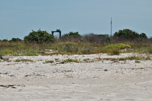 Peculiar infrastructure is always lurking behind the scrub when you look over your shoulder out on the beach at Cape Canaveral Air Force Station.