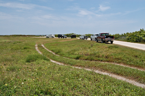 Cars parked at the entrance to the dune crossover, Complex 34, Cape Canaveral Air Force Station.